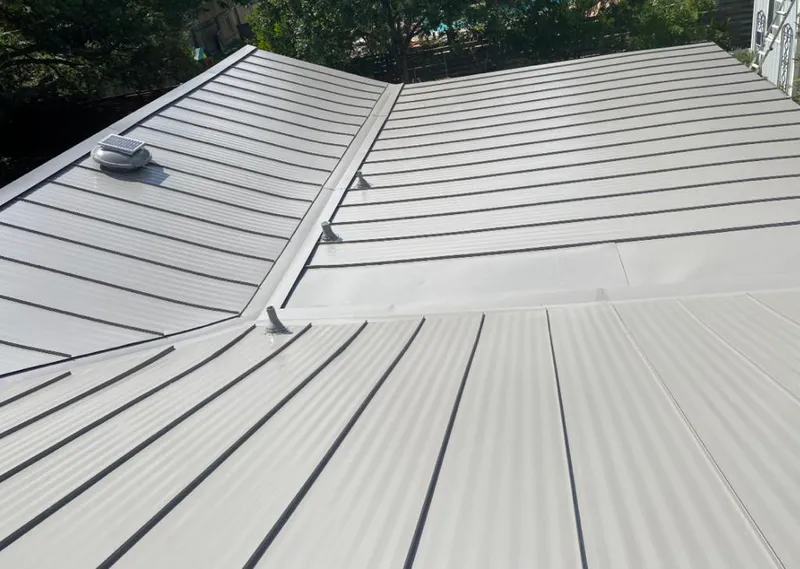Solar attic fan installed on a metal roof for Roof Ventilation in Lake Bluff